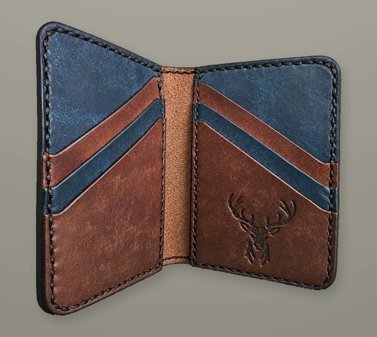 Open STAG vertical card wallet with angled pockets and an embossed stag mark